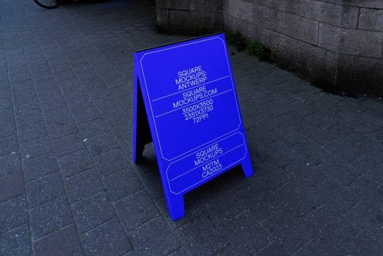 Blue A-board mockup with editable design presented on a sidewalk for outdoor advertising mockups, graphics display, designer templates.